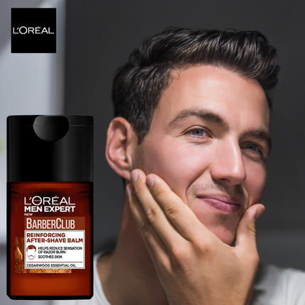 L'Oreal Men Expert BarberClub after-shave balm with a man touching his face.